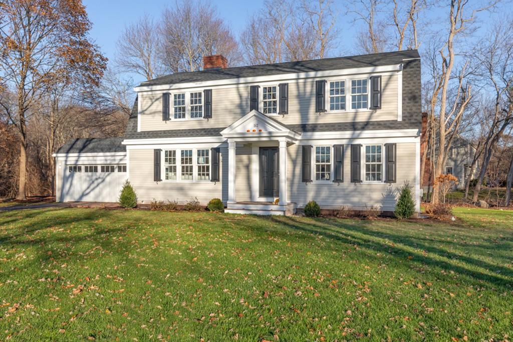 52 Union Street Hingham, MA 02043 - Photo 2 of 21 a front view of a house with a yard