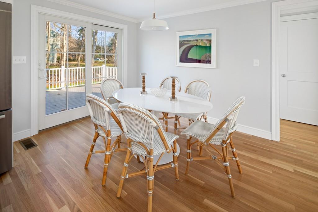 52 Union Street Hingham, MA 02043 - Photo 5 of 21 a view of a dining room with furniture and wooden floor