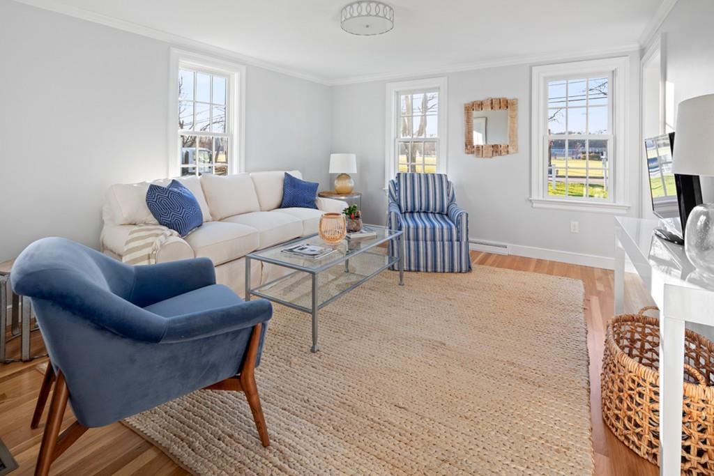 52 Union Street Hingham, MA 02043 - Photo 8 of 21 a living room with furniture a window and a rug