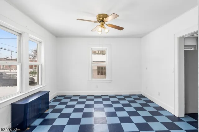 a black and white checkered floor with a black white checkered floor next to a window