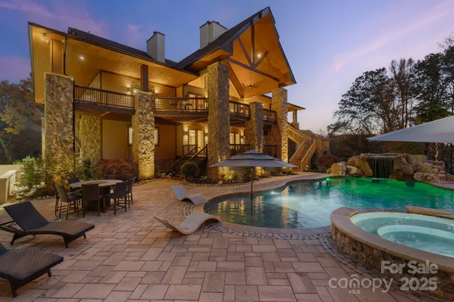 a view of pool with outdoor seating