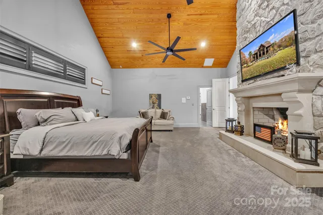 a bed room with a bed and a fireplace