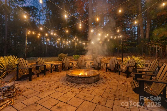 a outdoor space with lots of chairs and umbrellas