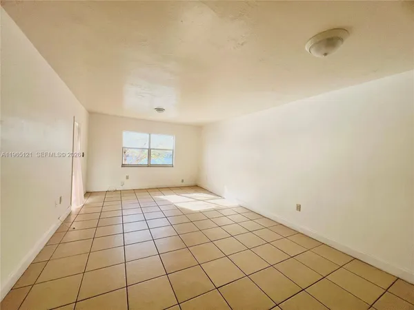 a view of an empty room and window