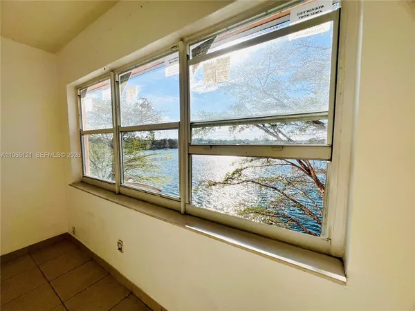 a view of a room with a large window