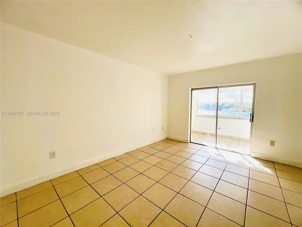 a view of an empty room and window