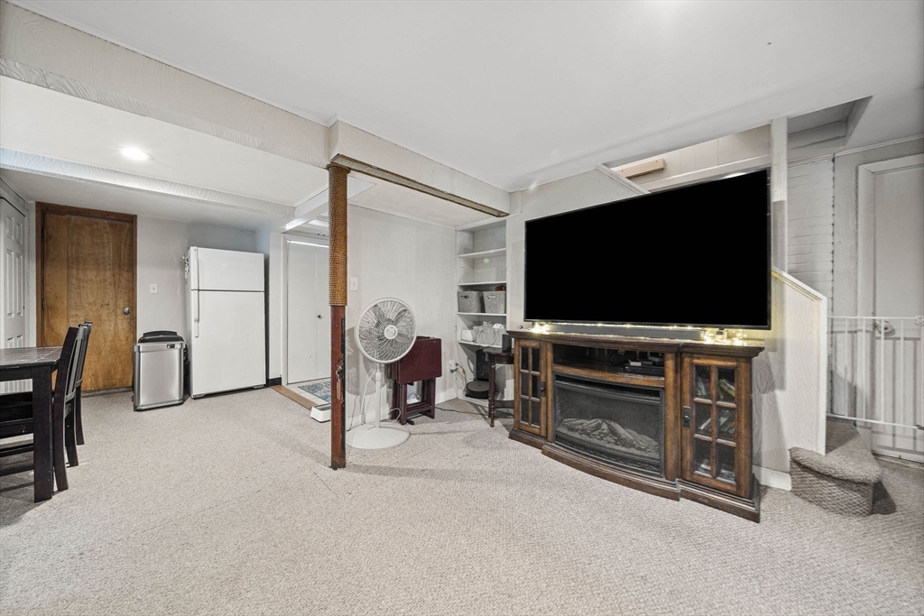15 D Street Hull, MA 02045 - Photo 32 of 42 a living room with furniture and a flat screen tv