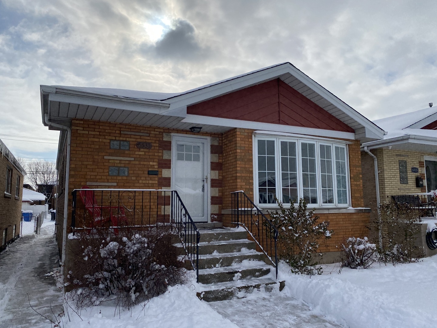 a front view of a house with garage