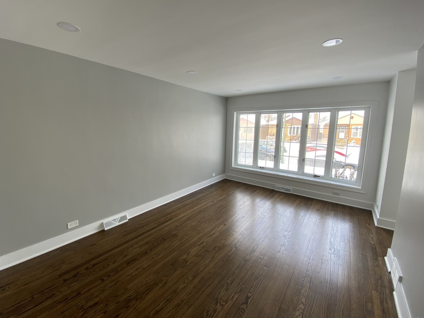 6531 West 64th Street Chicago, IL 60638 - Photo 12 of 19 a view of an empty room with wooden floor and a window