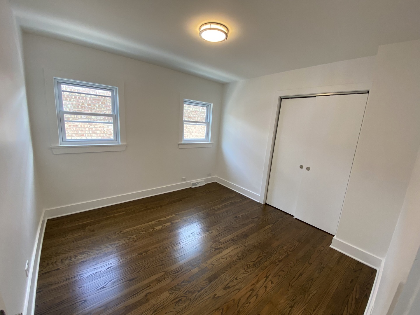 6531 West 64th Street Chicago, IL 60638 - Photo 9 of 19 an empty room with wooden floor and windows