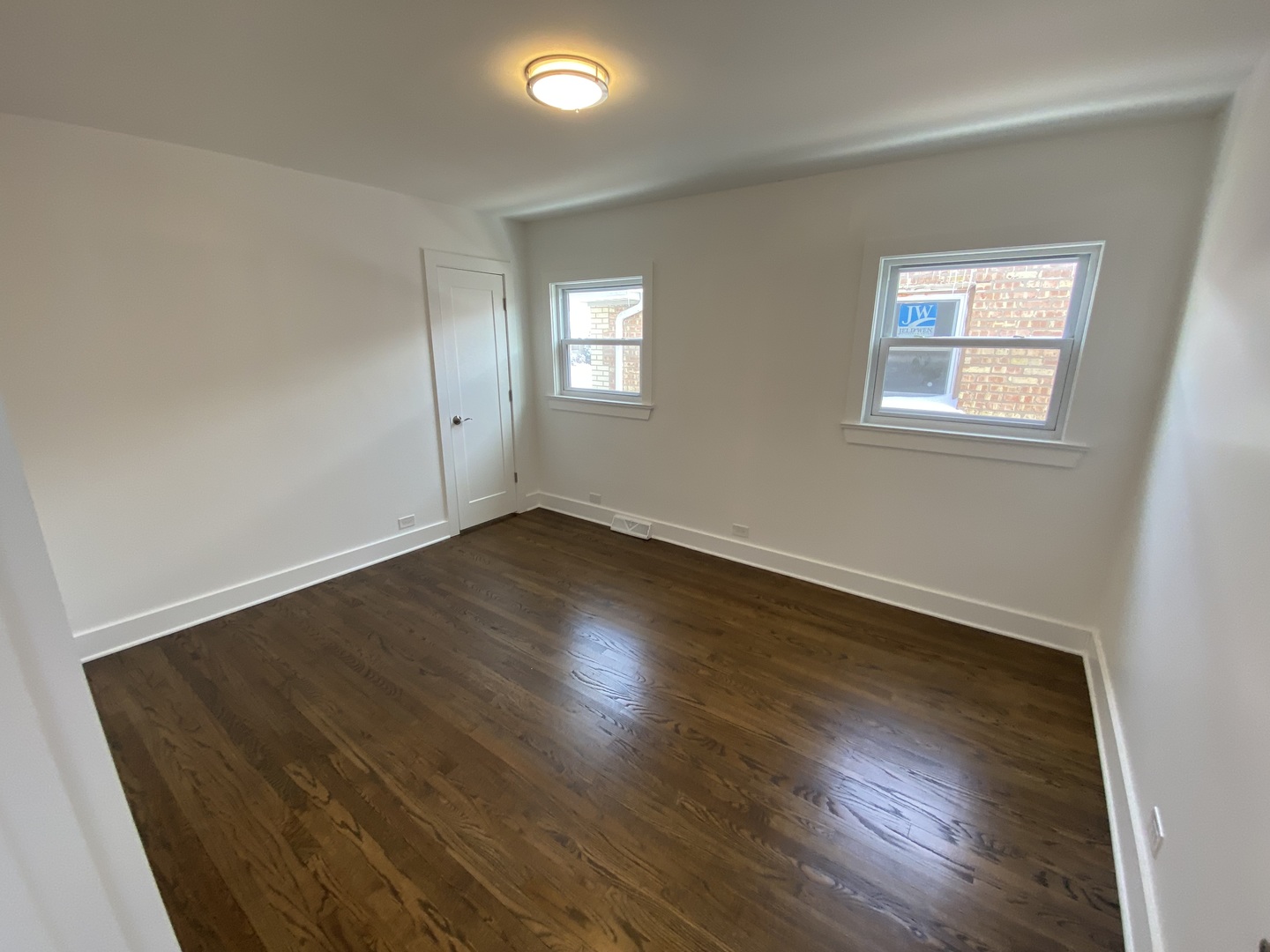 6531 West 64th Street Chicago, IL 60638 - Photo 10 of 19 a view of an empty room with wooden floor and a window