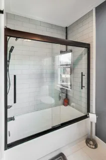 a bathroom with a shower and a bathtub