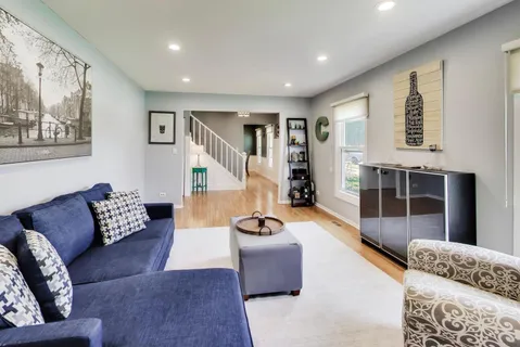 a living room with furniture and a rug