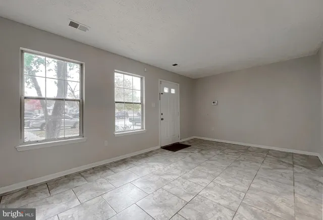 a view of an empty room with a window