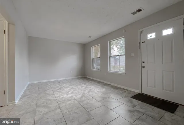 a view of an empty room and window
