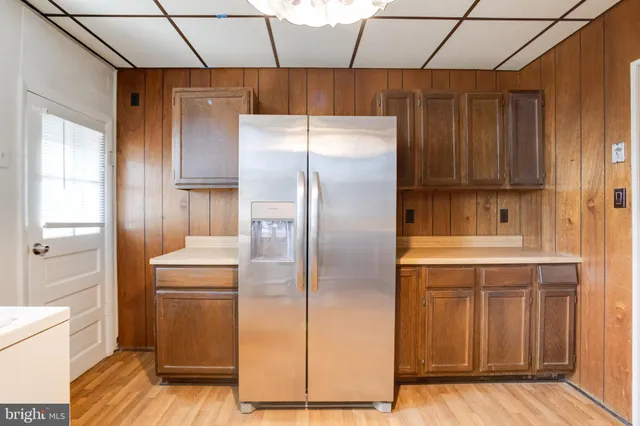 a view of a kitchen with a microwave and cabinets