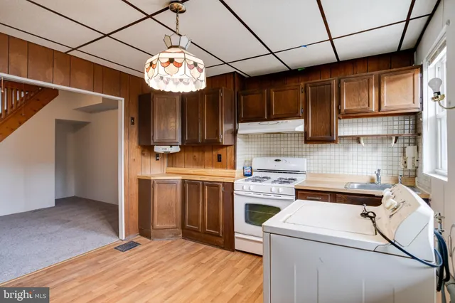 a view of a kitchen with an empty space