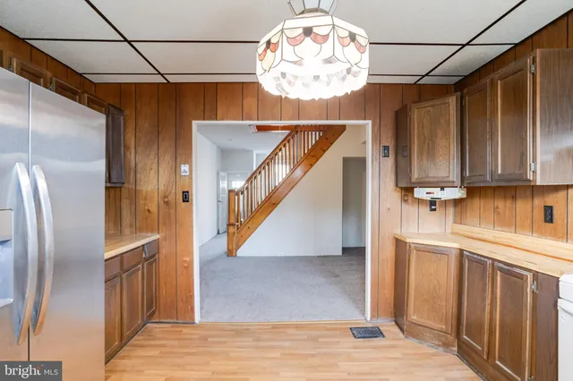 a view of a kitchen with a sink cabinets and a window