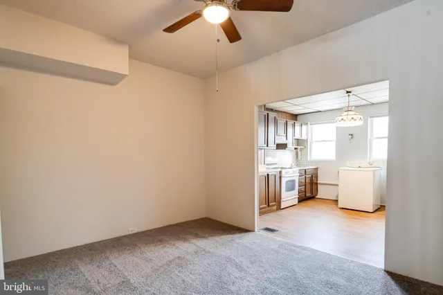 a view of staircase with wooden floor and windows