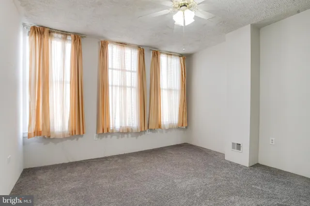 an empty room with windows