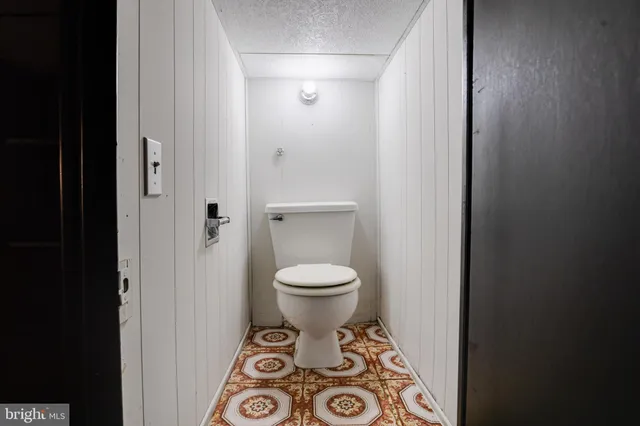 a bedroom with a bed and a sink