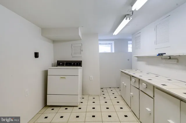 a view of a brick house with large windows