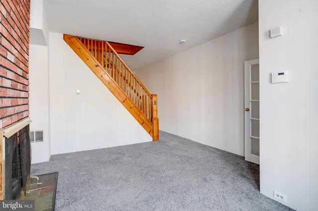 a view of an entryway with fireplace