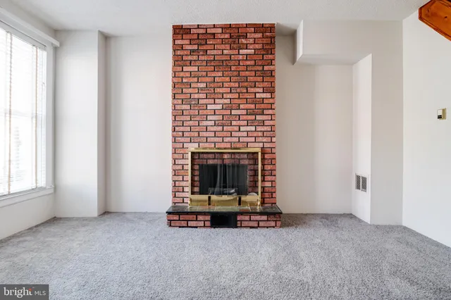 a kitchen with stainless steel appliances granite countertop a refrigerator a stove and a refrigerator