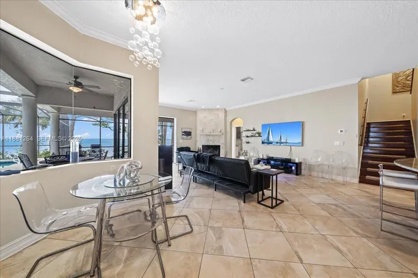 a living room with furniture gym equipment and a fireplace