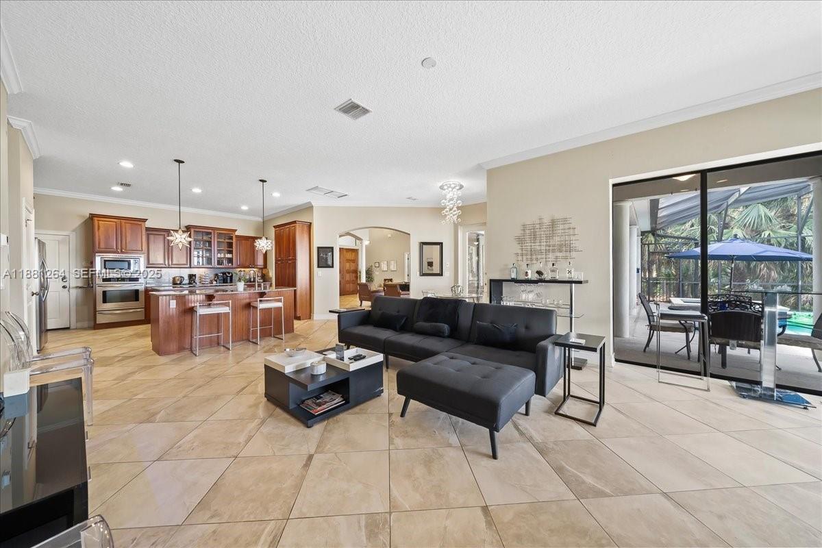 6340 Highway 1 Cocoa, FL 32927 - Photo 25 of 54 a living room with furniture and a view of kitchen