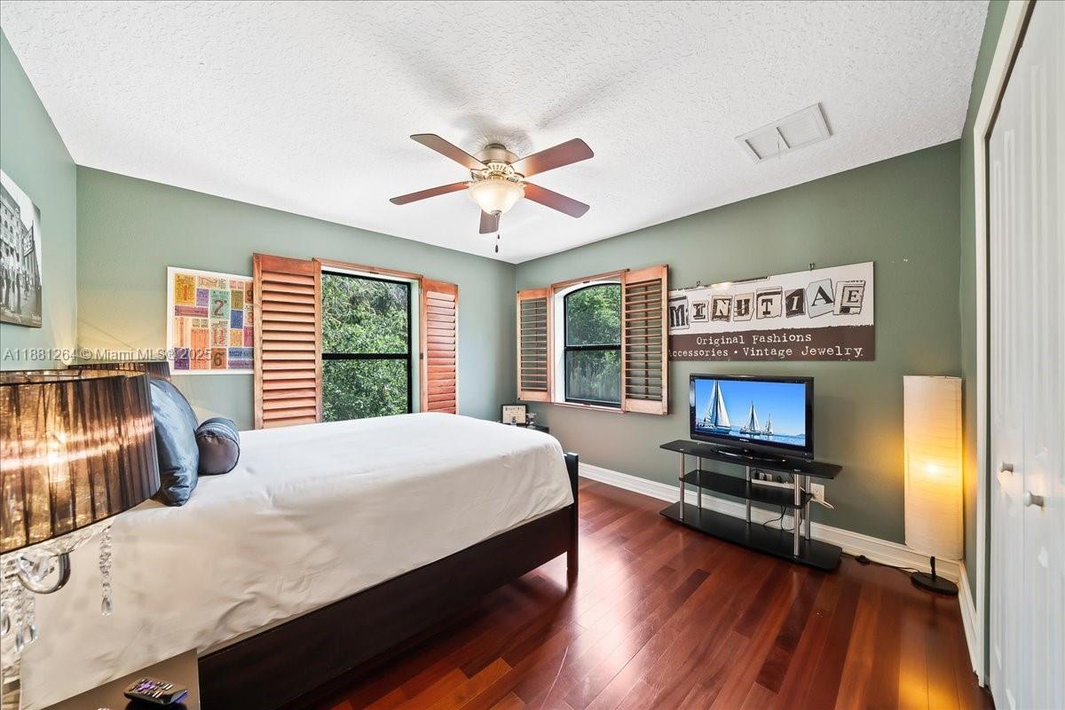 6340 Highway 1 Cocoa, FL 32927 - Photo 28 of 54 a bedroom with a bed and a chandelier