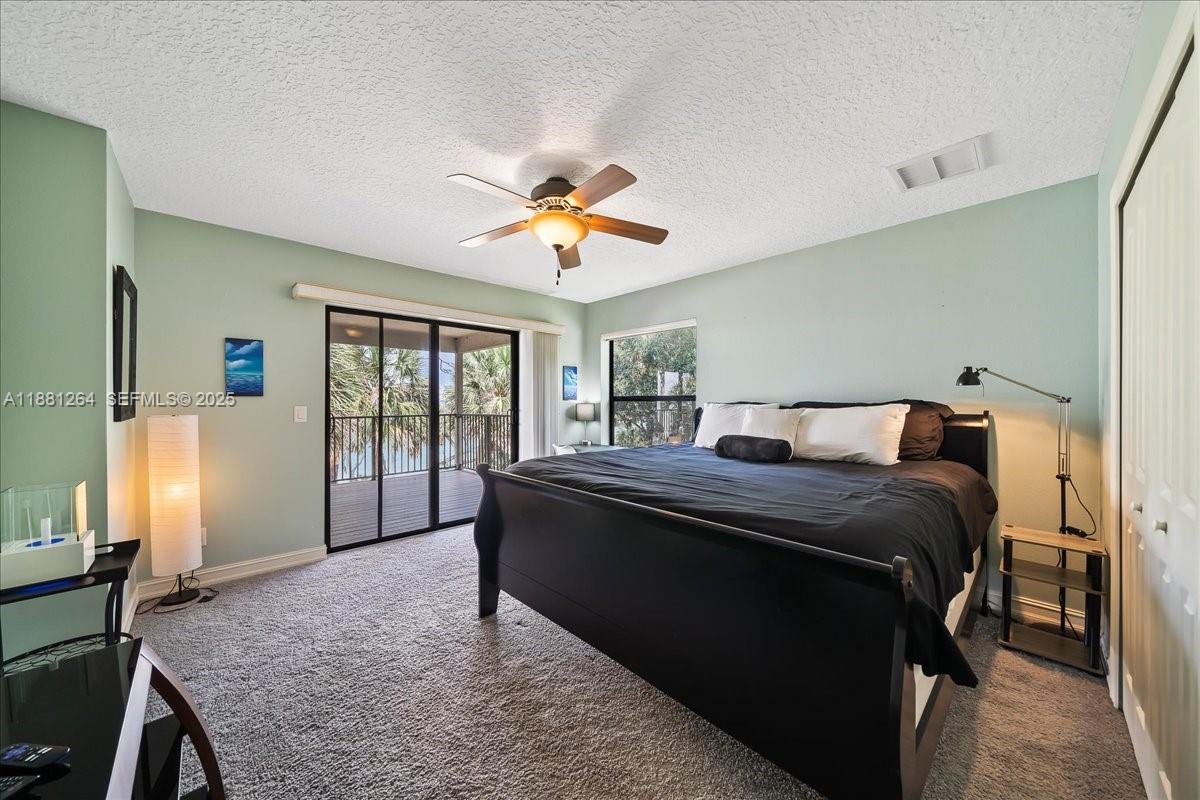 6340 Highway 1 Cocoa, FL 32927 - Photo 29 of 54 a bed sitting in a bedroom next to a window