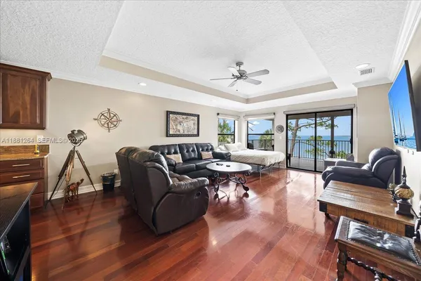 a kitchen with stainless steel appliances granite countertop a refrigerator and wooden cabinets
