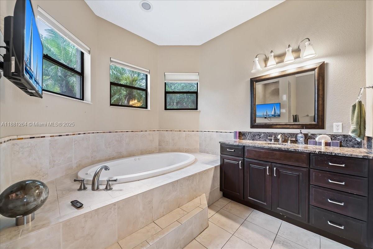 6340 Highway 1 Cocoa, FL 32927 - Photo 43 of 54 a bathroom with a sink and a mirror