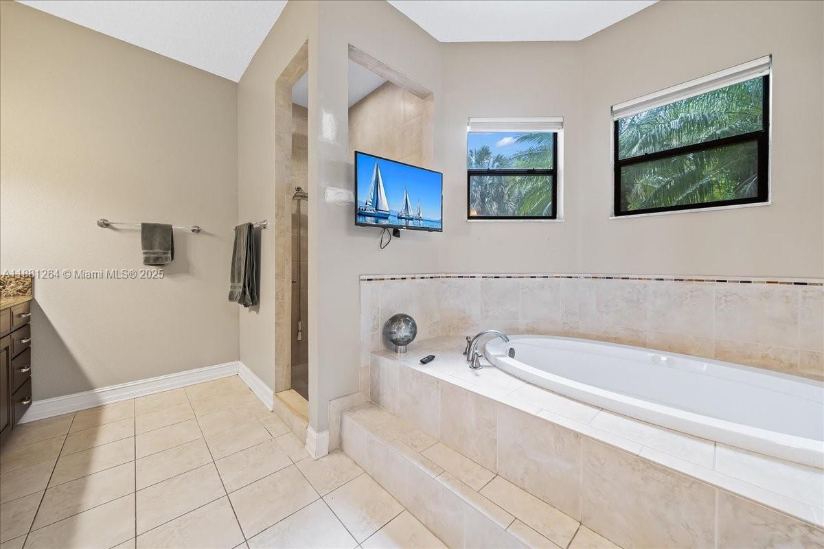 6340 Highway 1 Cocoa, FL 32927 - Photo 45 of 54 a bathroom with a bathtub and a shower