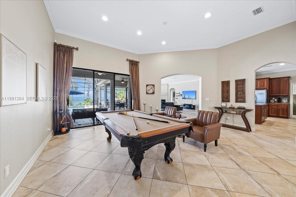 6340 Highway 1 Cocoa, FL 32927 - Photo 6 of 54 a living room with furniture a table and a potted plant