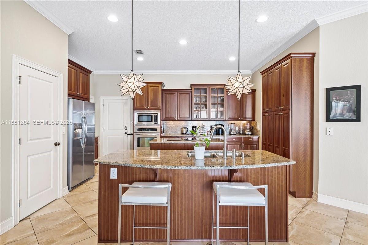 6340 Highway 1 Cocoa, FL 32927 - Photo 10 of 54 a kitchen with refrigerator and cabinets