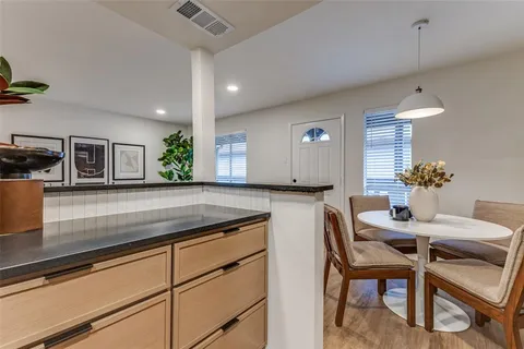 a kitchen with a table and chairs in it