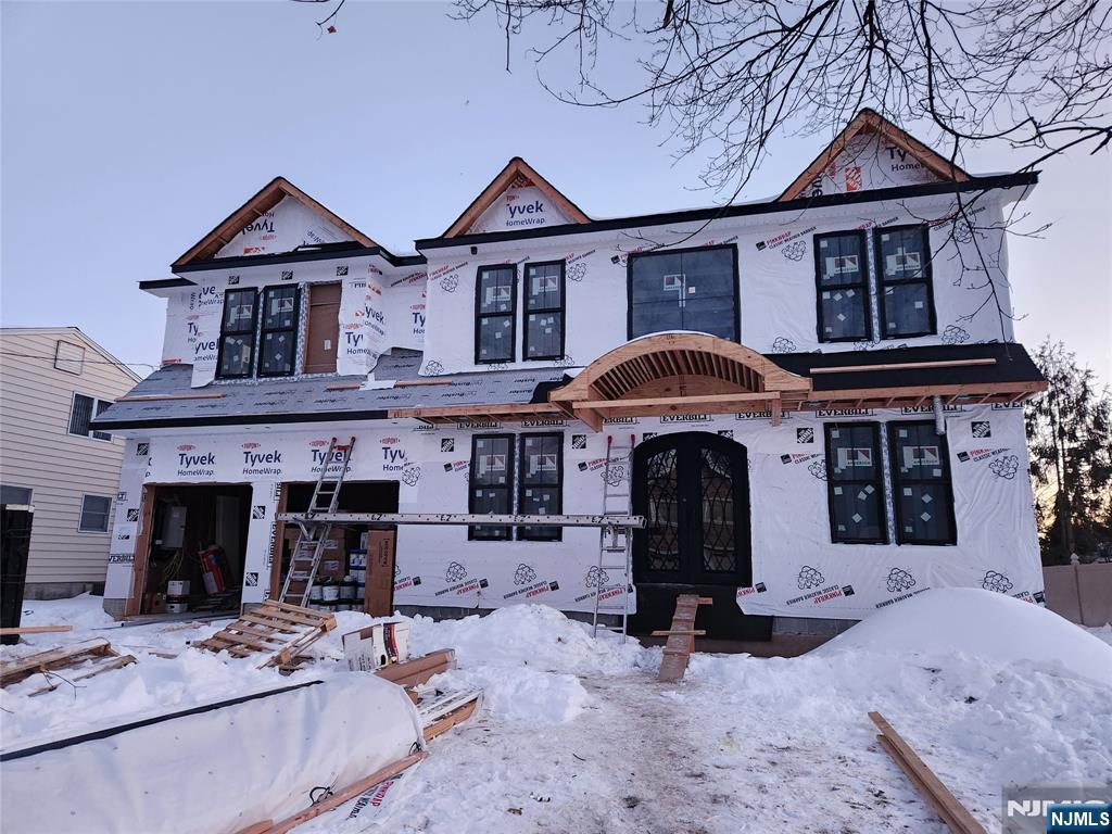 a view of a house with furniture and a roof