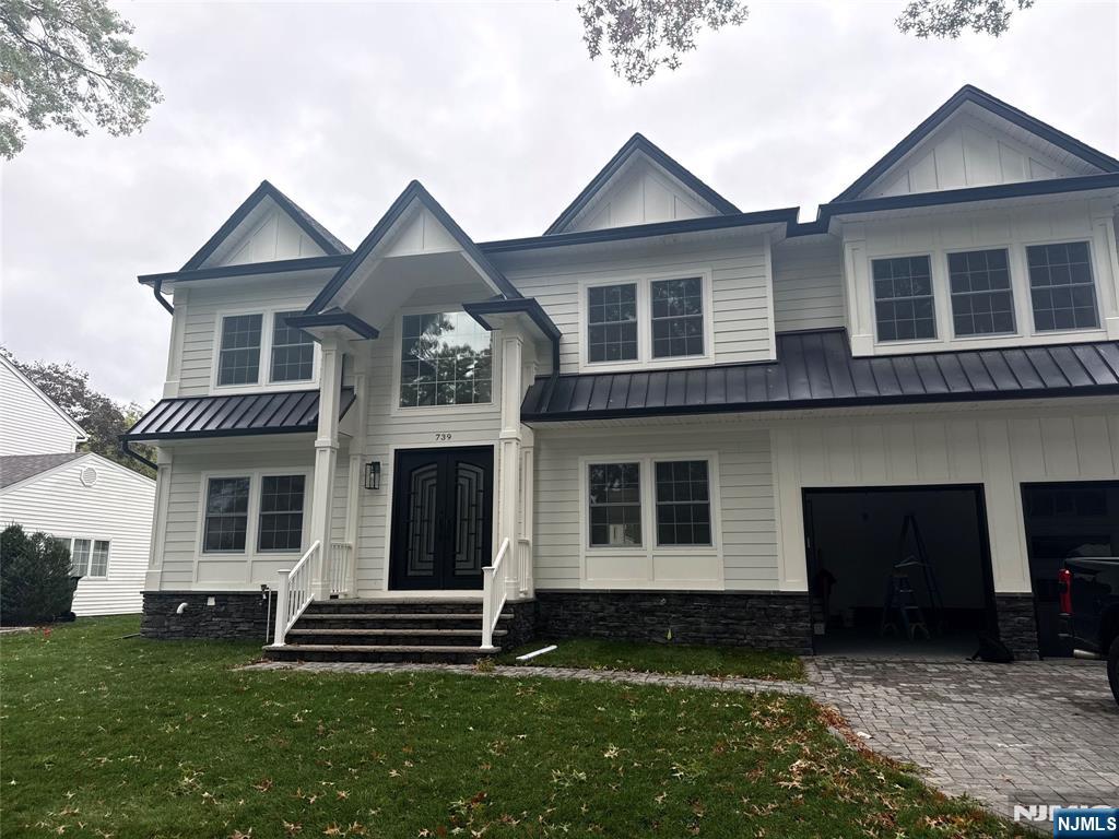 86 Azalea Street Paramus, NJ 07652 - Photo 2 of 2 a front view of a house with a yard
