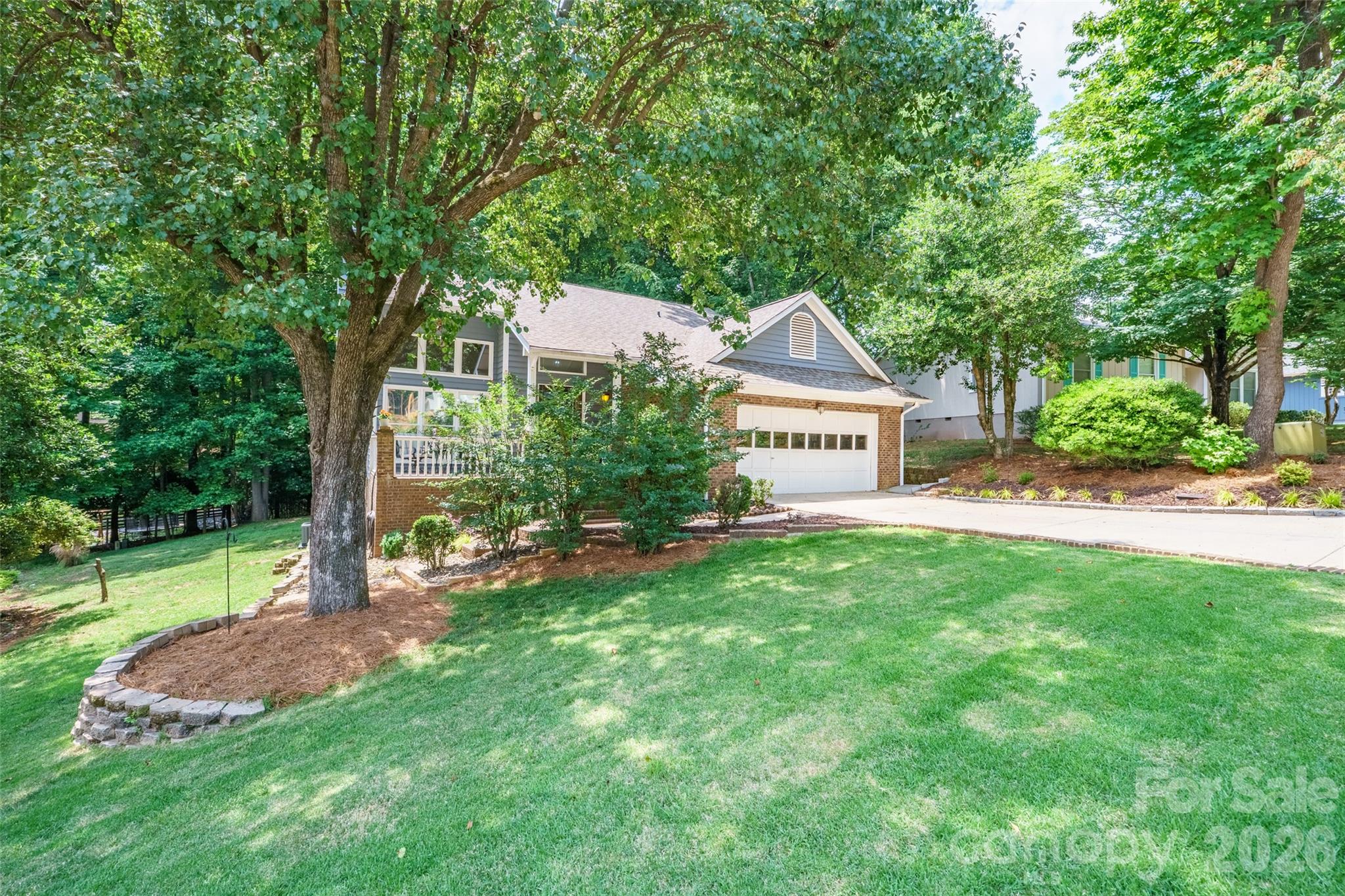 19017 Kailua Circle Tega Cay, SC 29708 - Photo 44 of 46 a front view of a house with a yard and tree s