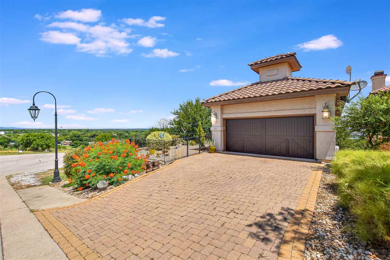 514 Bendito Way Marble Falls, TX 78654 - Photo 1 of 1 a front view of a house with a yard and garage