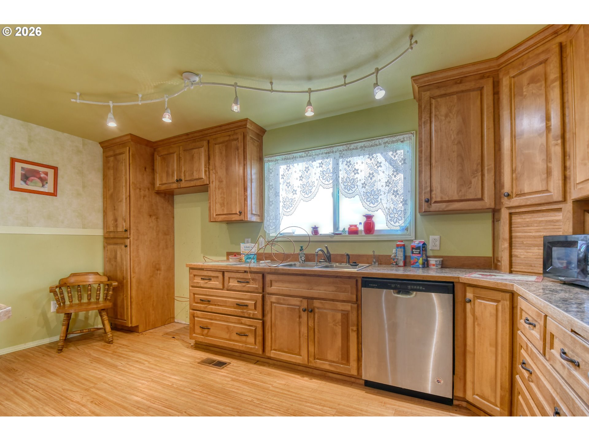 554 West High Street Athena, OR 97813 - Photo 12 of 46 a kitchen with stainless steel appliances granite countertop a sink stove and cabinets