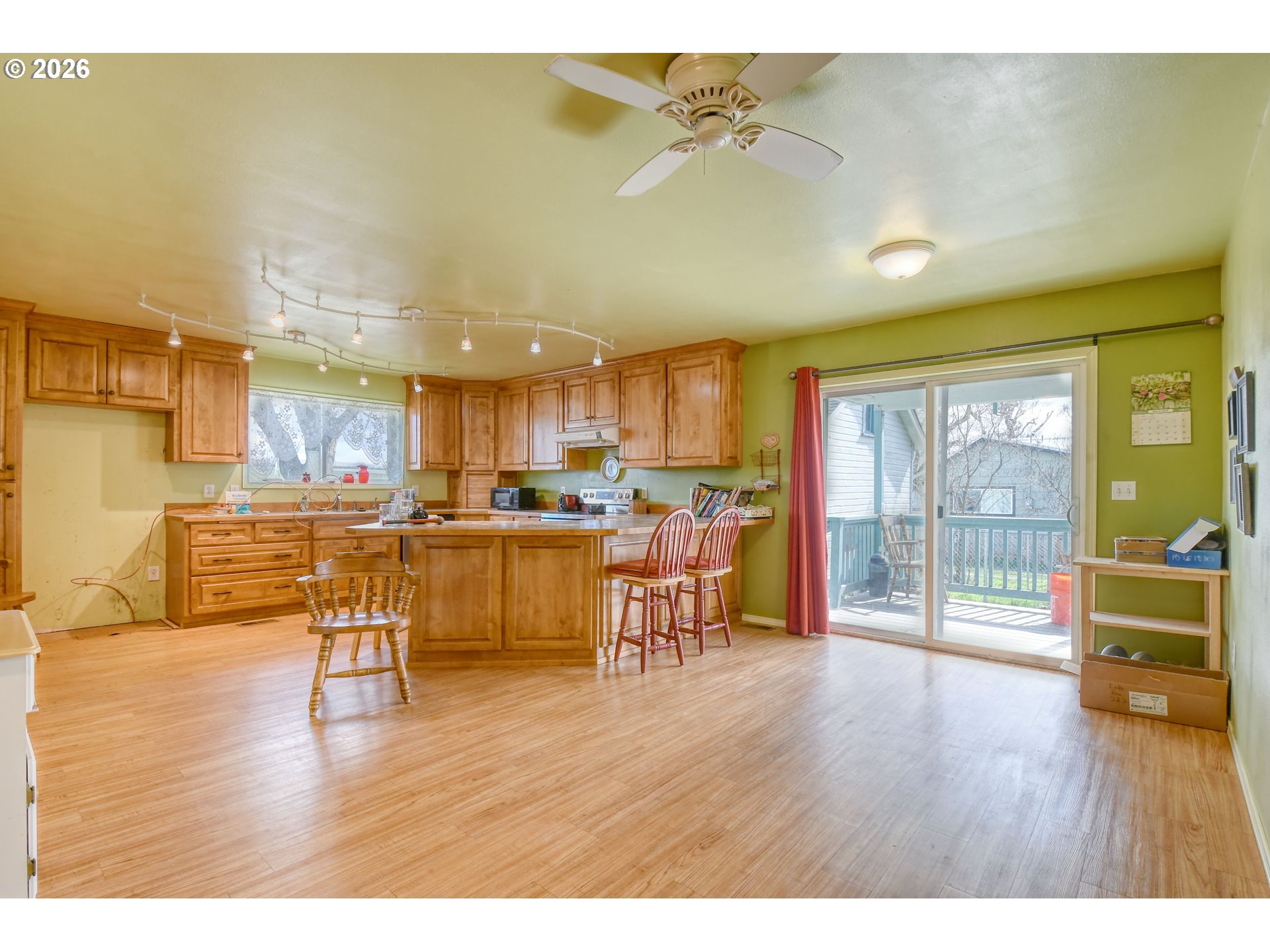 554 West High Street Athena, OR 97813 - Photo 15 of 46 a living room with kitchen view and a wooden floor