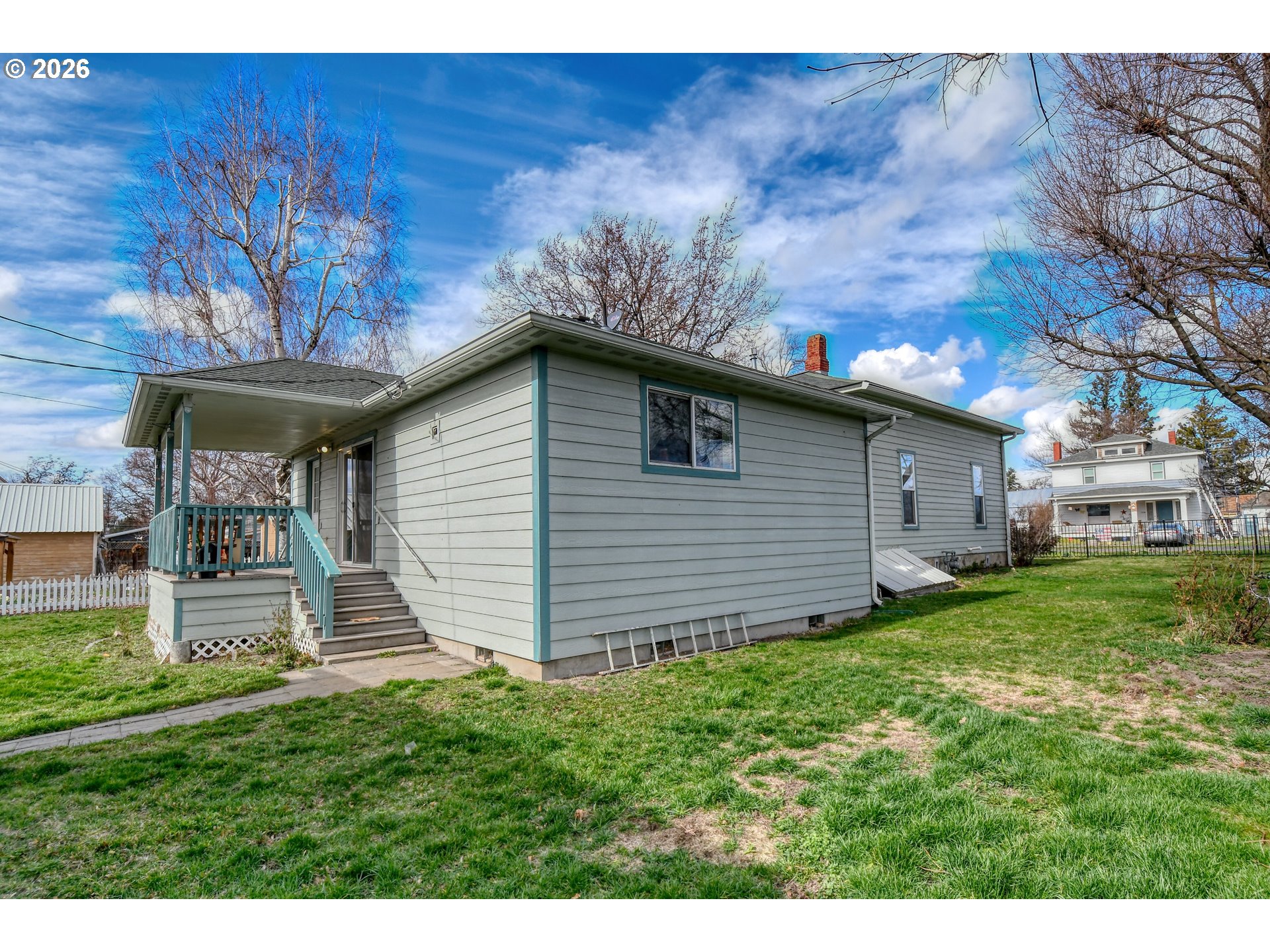 554 West High Street Athena, OR 97813 - Photo 33 of 46 a view of a backyard with plants and large trees