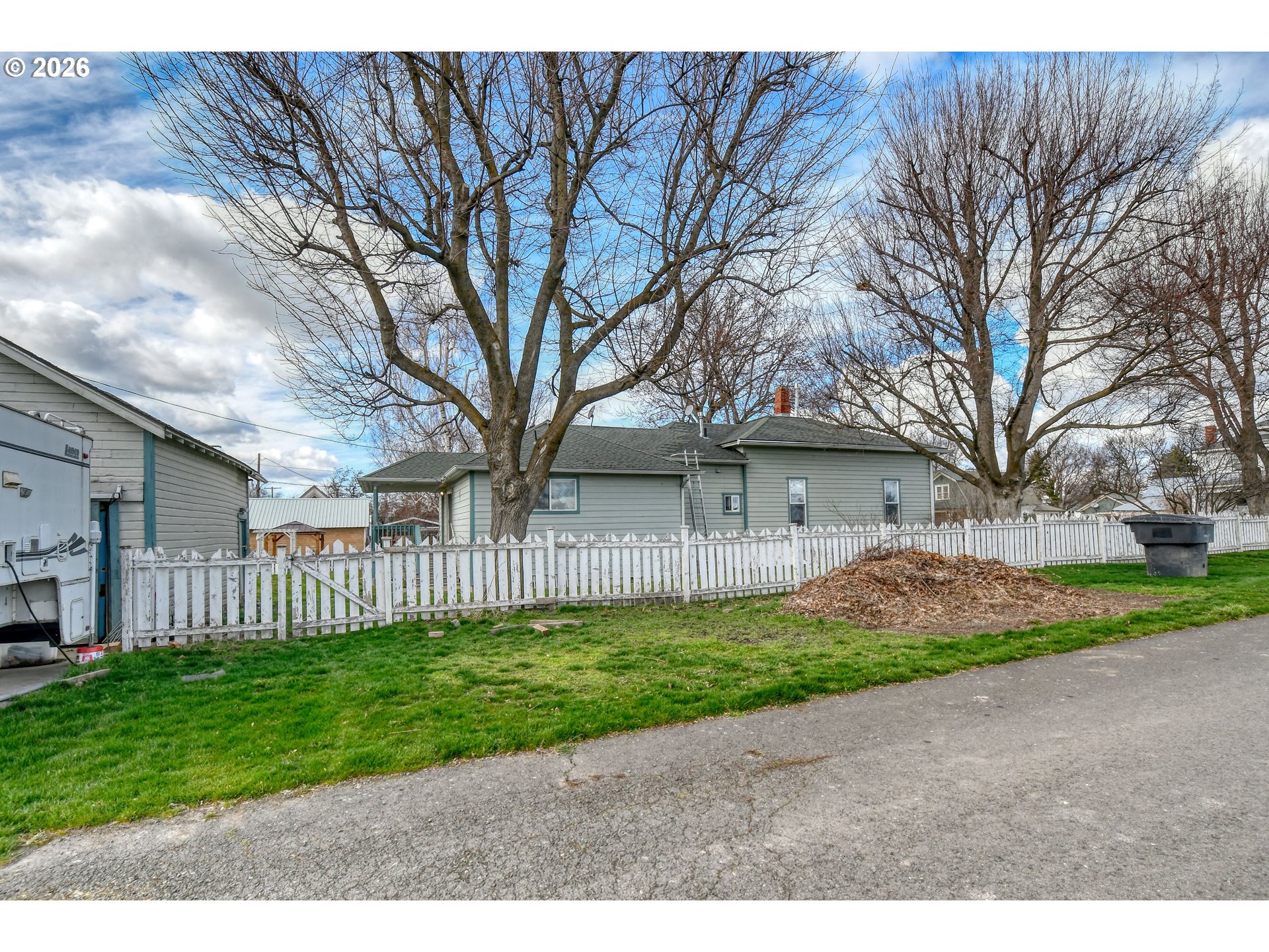 554 West High Street Athena, OR 97813 - Photo 41 of 46 a view of a yard with a house and a tree