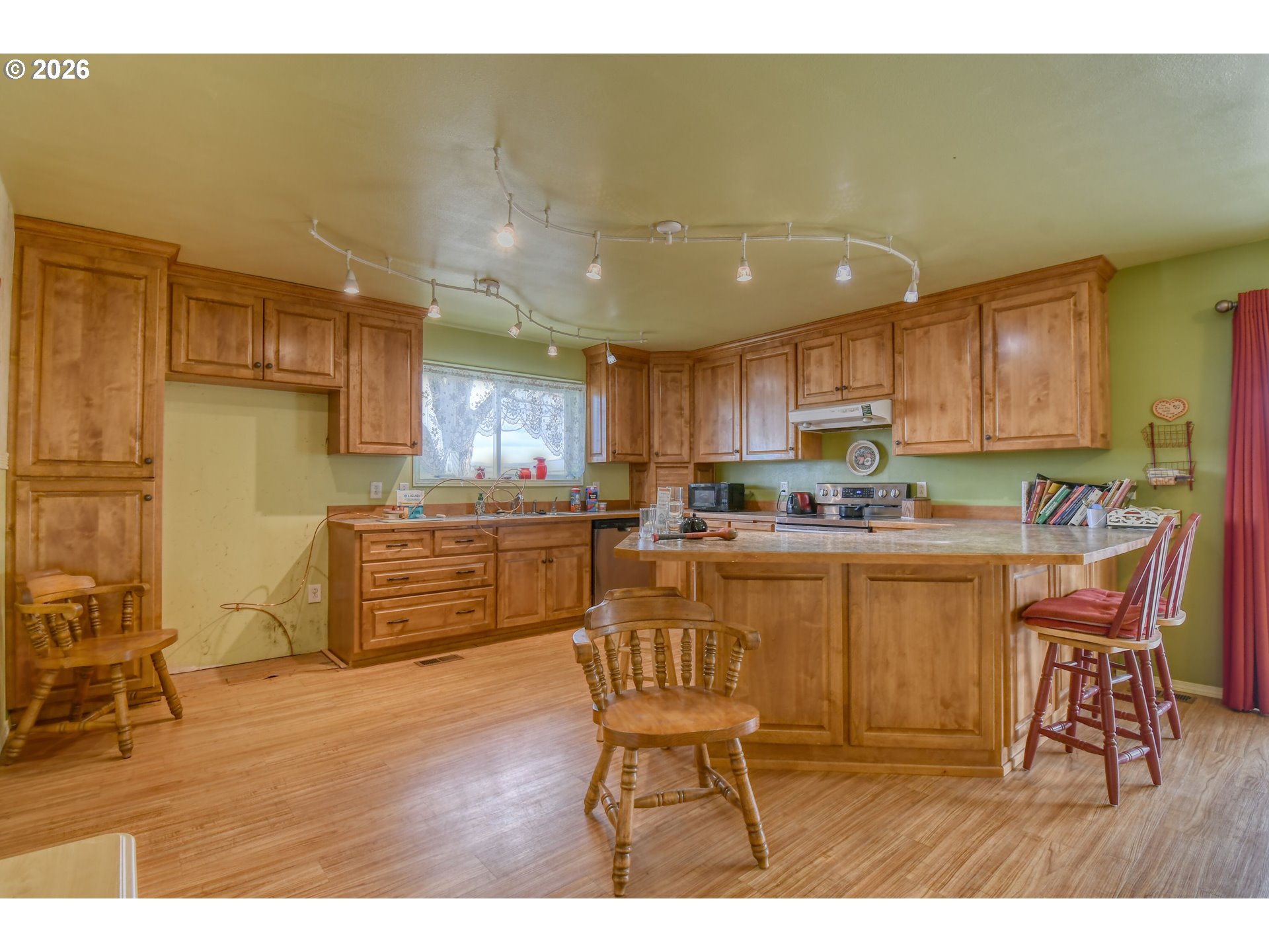 554 West High Street Athena, OR 97813 - Photo 8 of 46 a kitchen with stainless steel appliances granite countertop a stove a sink a microwave and a refrigerator
