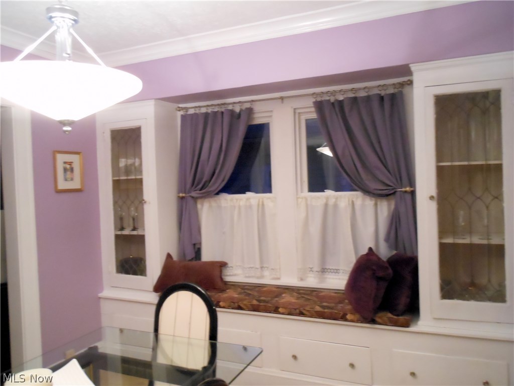 891 Montford Road Cleveland, OH 44121 - Photo 20 of 25 Closer view of the Dining Room Built-ins. Only the purple curtains stay.