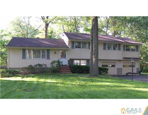 5 Huntington Road Edison, NJ 08820 - Photo 1 of 7 a black and white photo of a house
