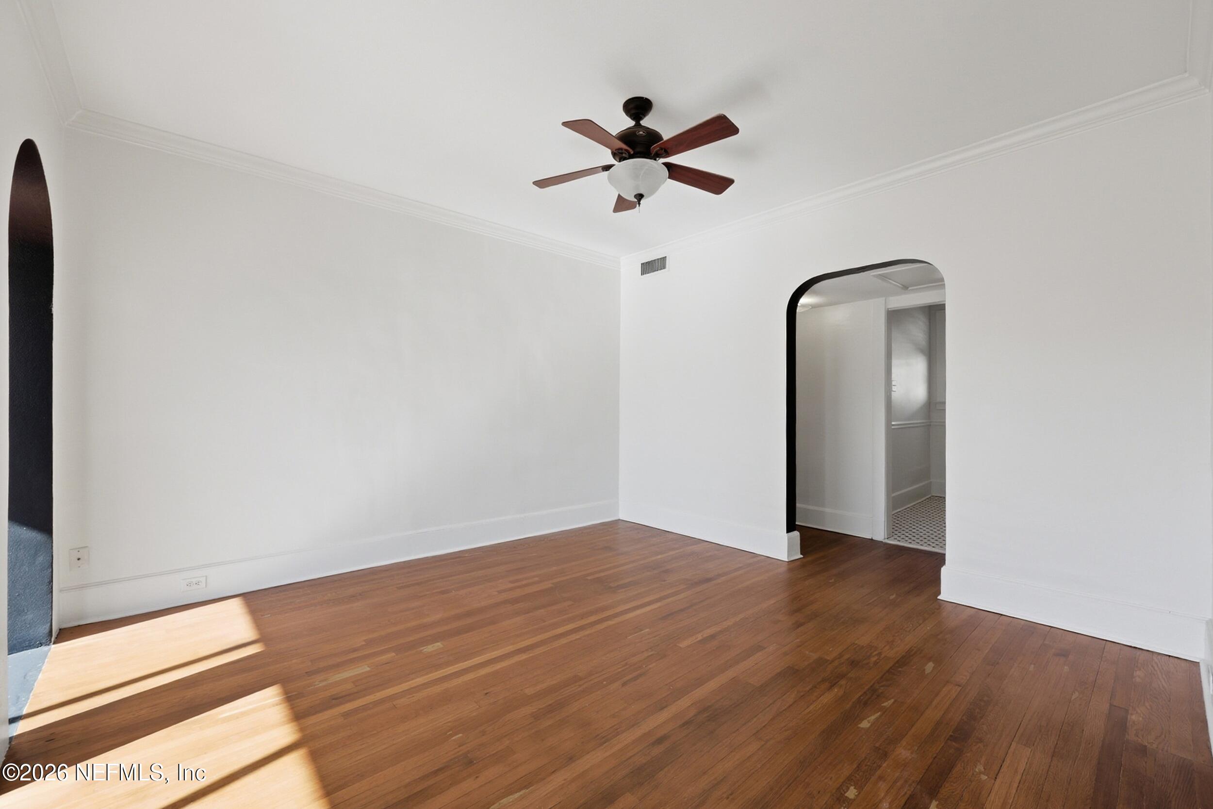 1625 Seminole Road, Unit 1625 Jacksonville, FL 32205 - Photo 11 of 22 a view of a room with wooden floor fan and window